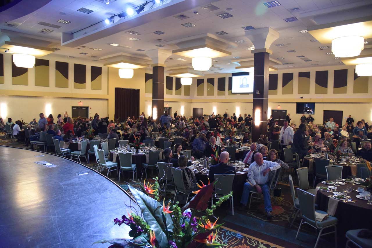 Prime, Inc. truck drivers who have driven one million miles, in a ball room celebrating at the Night of Millionaires.