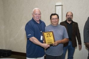 Roberto Alonzo, one of Prime Inc.'s instructor of the year, standing next to owner Robert Low.