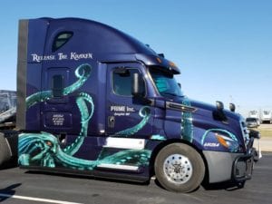 A teal Kraken design wraps around a truck.