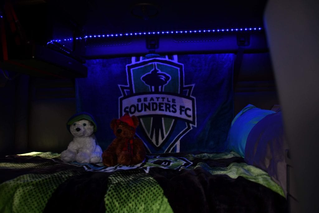 Prime Inc. truck interior decked out in Seattle Sounders soccer decorations.